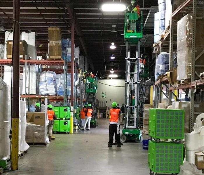 SERVPRO team working to restore a DeKalb warehouse after a water damage event