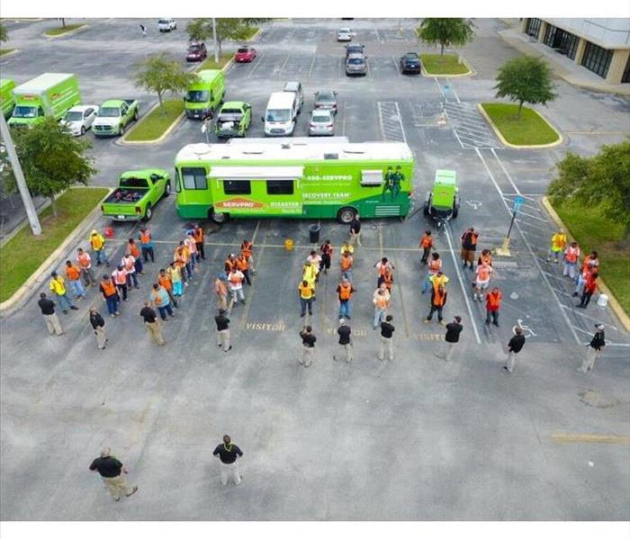 SERVPRO trucks and technicians in the parking lot of an Atlanta business