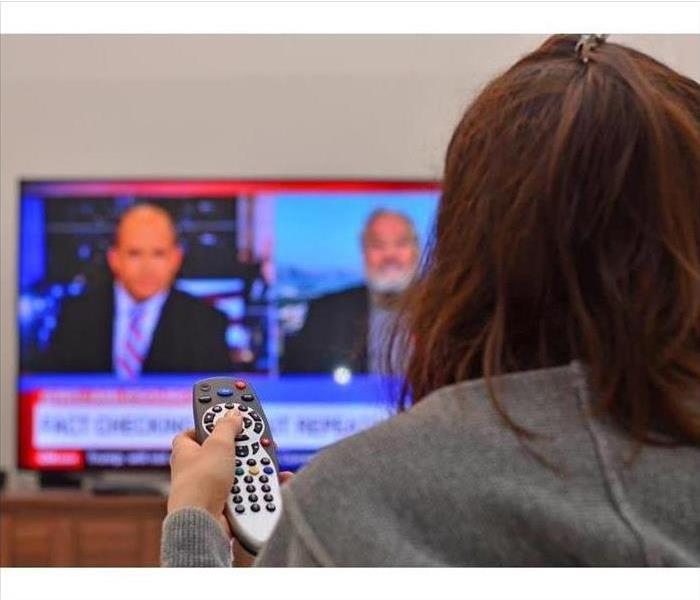 Woman watching news